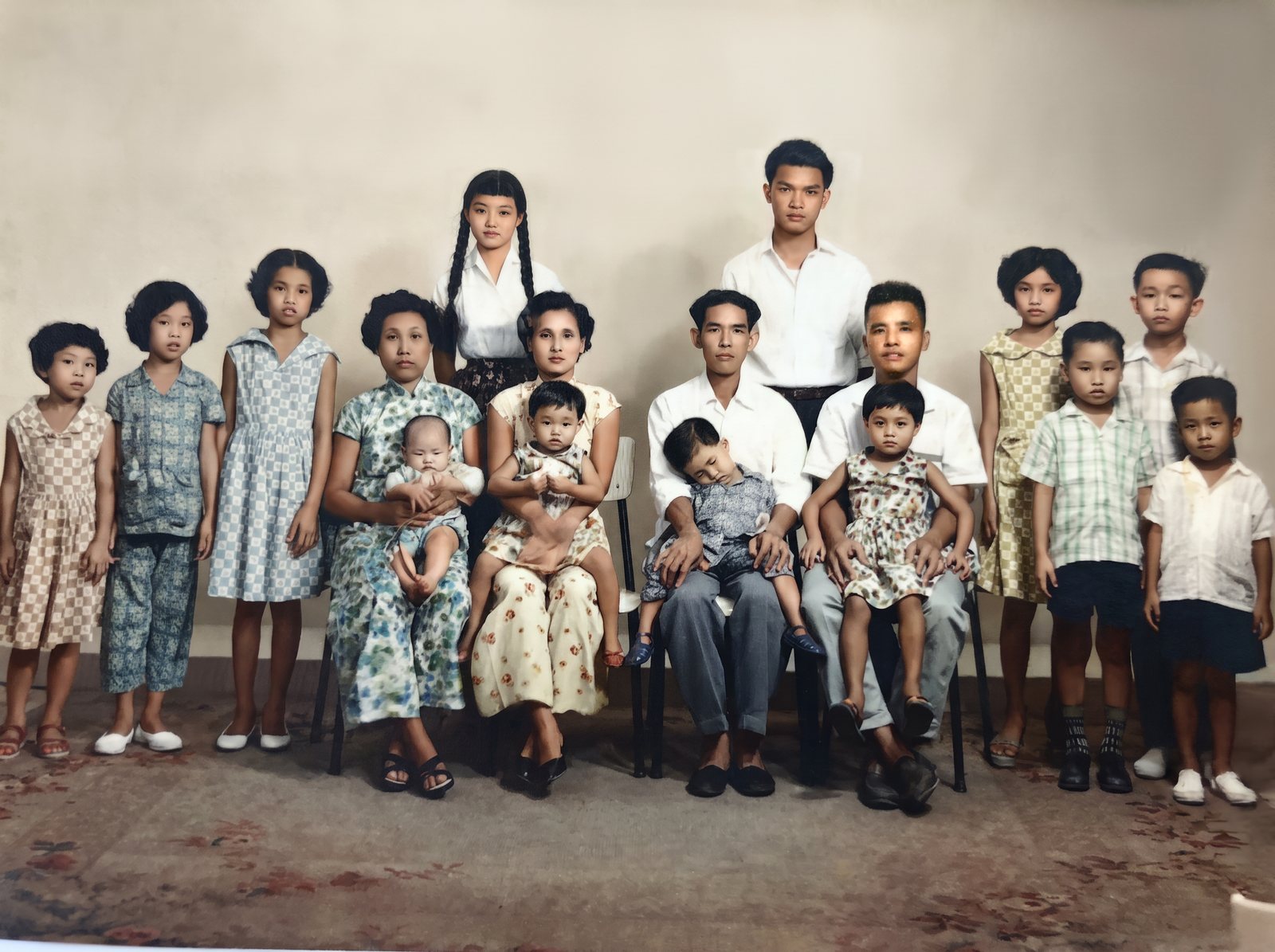 The family together in a studio portrait taken in Singapore in the 1960s