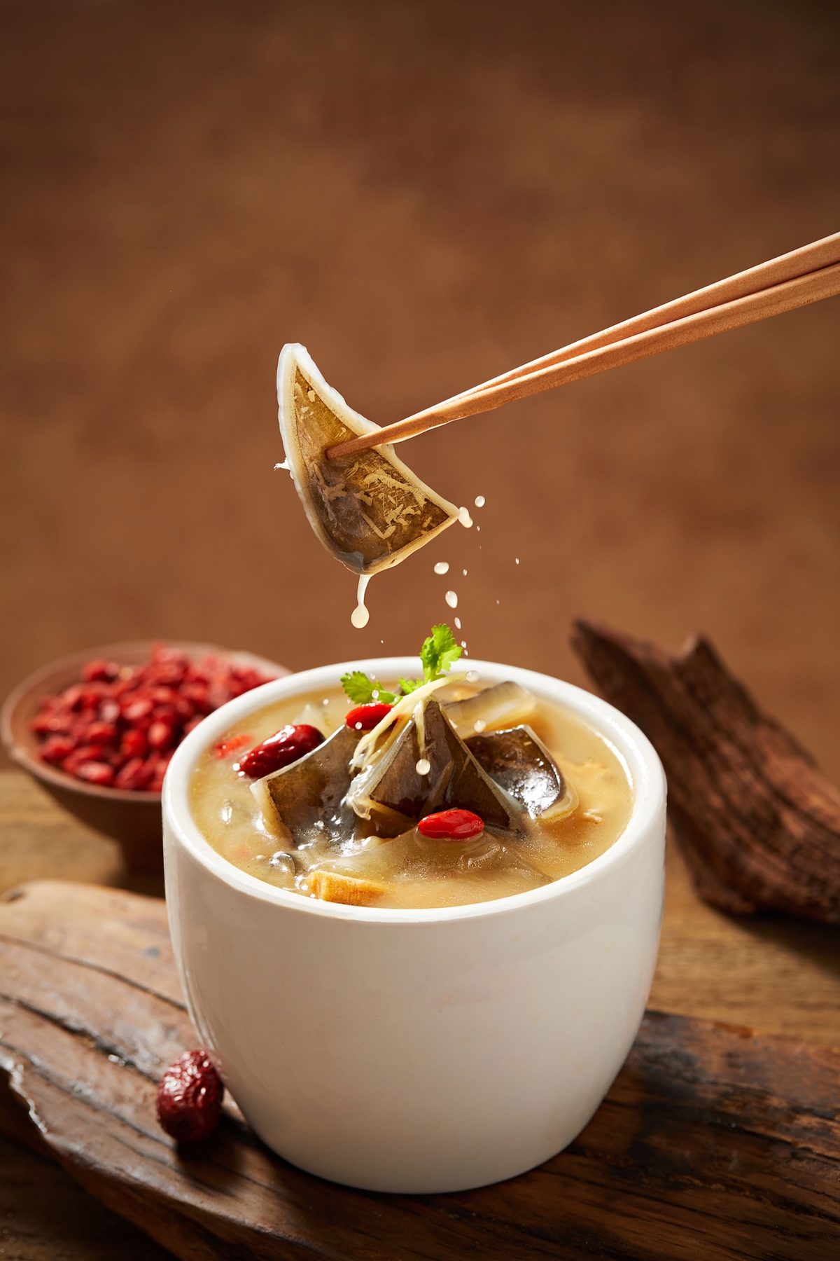 Nourishing Double Boiled Turtle Soup in a white double-boiling cup